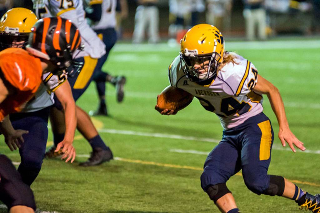 Aberdeen running back Aidan Neeley, right, carries the football during the Bobcats 21-14 win over Centralia on Friday at Centralia High School. (Photo by Jared Wenzelburger | The Chronicle)