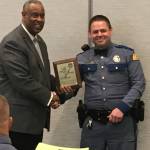 Washington State Patrol Trooper David Franzmann of Hoquiam, right, receives a life-saving award from WSP Chief John R. Batiste.