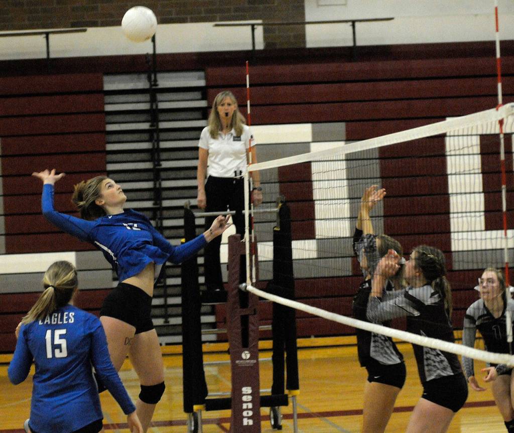 Elmas Jaelyn Sackrider comes up with a kill against Montesano on Tuesday. Sackrider led the Eagles with 28 kills in Elmas 3-2 victory. (Hasani Grayson | The Daily World)
