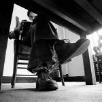 Photo by Jerry Gay                                In a room at the Garfield County Jail in Glenwood Springs, Colorado, Ted Bundy peers beyond the page of the book he is reading.
