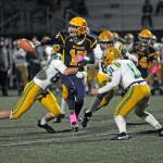 Aberdeen quarterback Ben Dublanko looks to pitch the ball during the second half of the Bobcats game against Tumwater on Friday. (Ryan Sparks | The Daily World)