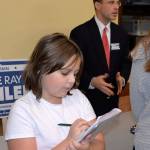 Louis Krauss | The Daily World                                Ocean Shores Girl Scout Ashlynn McKay takes notes after interviewing Superior Court Judge Ray Kahler.