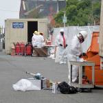 Louis Krauss | Grays Harbor News Group                                Restoration Management Company employees work on restoring items from Aberdeens Armory building Wednesday.