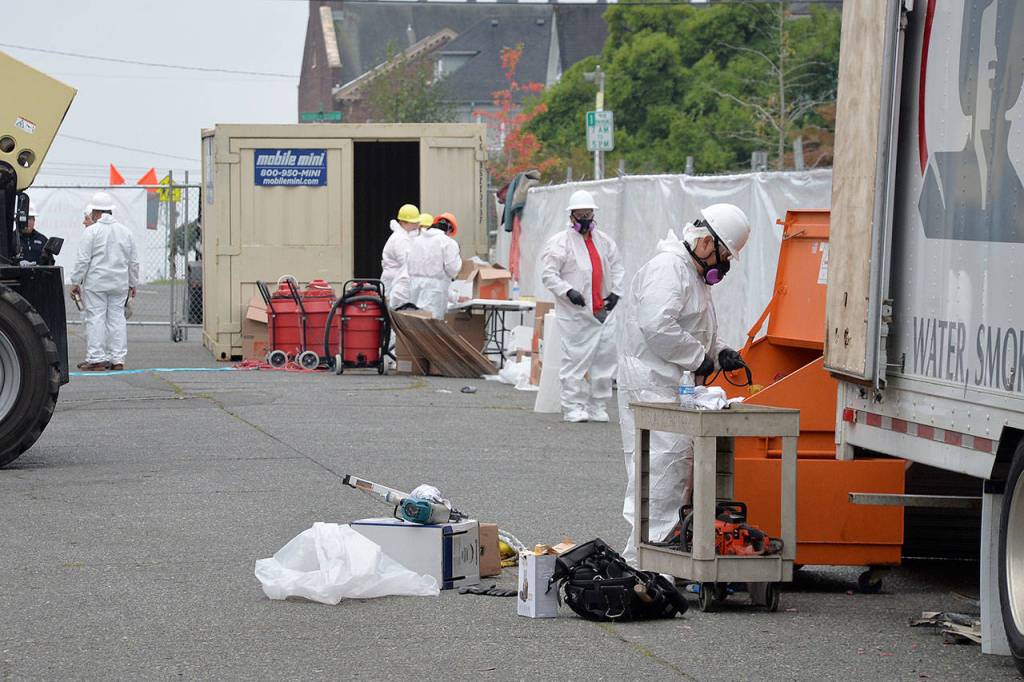 Louis Krauss | Grays Harbor News Group                                Restoration Management Company employees work on restoring items from Aberdeens Armory building Wednesday.