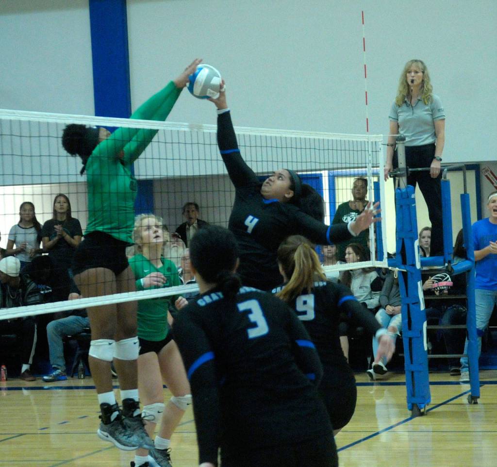 Grays Harbors Crimson Maafala gets her shot blocked by Highlines Adrienne Haggerty, left, on Wednesday night. (Hasani Grayson | Grays Harbor News Group)