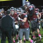 Hoquiam players run towards head coach Jeremy McMillan to celebrate thier vicory over Montesano on Friday at Olympic Stadium. (Hasani Grayson | Grays Harbor News Group)