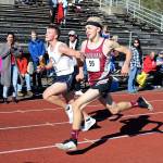 Hoquiams Adam Peterson, right, and Life Christian Academys Jake Martin approach the finish line of the boys varsity cross country race at the Grizzly Alumni Invitational on Saturday at Hoquiam High School. The two runners crossed the finish line at 17:20 and, after photos were inconclusive, were determined to have tied for first place. (Photo by Richelle Barger)