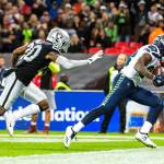 Seattle Seahawks wide receiver David Moore makes a touchdown reception against Oakland Raiders cornerback Daryl Worley on Sunday, Oct. 14, 2018 at Wembley Stadium in London, England. (Bettina Hansen/Seattle Times/TNS)