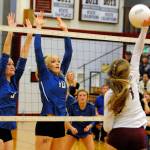 Elmas Maddie Clark, left, and Sarah Bridge attempt to block a kill attempt by Hoquiams Sharaya Brydon on Tuesday in Hoquiam. (Ryan Sparks | Grays Harbor News Group)