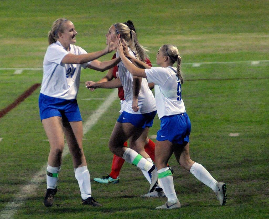 Elmas Kassedy Olson, right, celebrates with Molly Johnston after Olson broke the scorless tie in the first half of a game against Hoquiam at Olympic Stadium. (Hasani Grayson | Grays Harbor News Group)