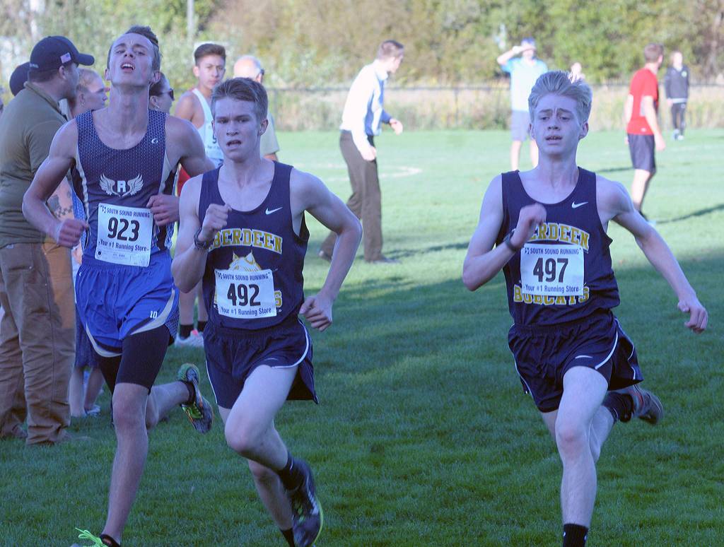 Aberdeens Gary Sherman, middle, and Jordan McKinney, right, race each other near the finish line at the 2A Evergreen League meet in Tumwater. (Hasani Grayson | Grays Harbor News Group)