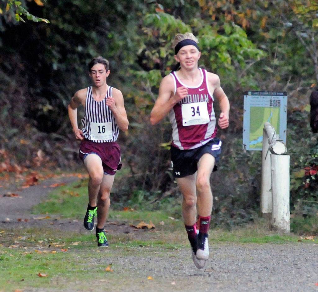Hoquiams Adam Petersen, right, leads Montesanos Martin Shuck in the boys race of the 1A Evergreen league-championship meet on Thursday in Montesano. (Ryan Sparks | Grays Harbor News Group)