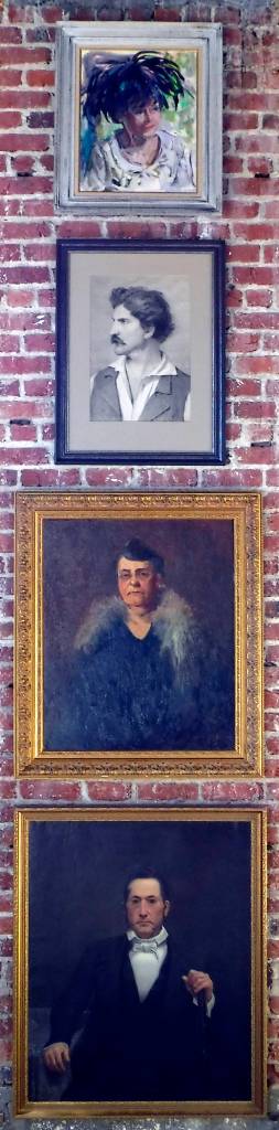 (Photo by Mitchell Chapman) From the top, portraits painted by Elizabeth Curtis, Vicente Seritti, Alice Hulich Preston Lavallee and U.C. Tenney. All purchased on eBay; hung on a narrow strip of brick wall.