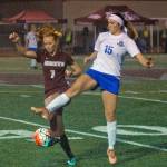 Montesanos Glory Grubb (7) settles down a ball while defended by Elmas Autumn Kearse in the first half of Montes shootout victory on Thursday. (Hasani Grayson | Grays Harbor News Group)