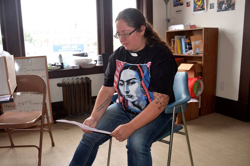 Louis Krauss | The Daily World                                The Rev. Sarah Monroe looks over a list of the 13 homeless people who have died in Aberdeen in the past year.