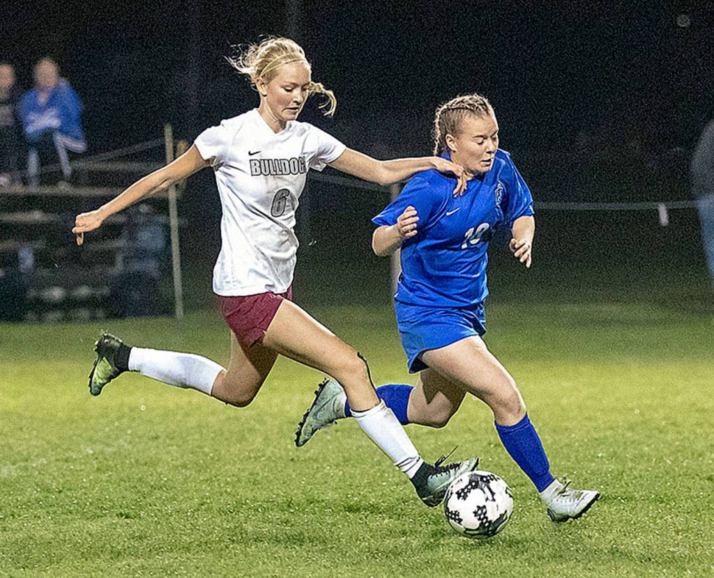 Montesanos Anna Ayers, left, battles for possession with Elmas Rebeka Lensegrav on Oct. 18. Ayres was named co-offensive MVP for the 1A Evergreen league. (Photo by Shawn Donnelly)