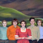 Photos by Paulian Beardsley                                The Pontipee brothers flank Milly (Kendall Cavin) after she teaches them about etiquette and courting a girl. From left, Adams six brothers are played by Trevor Mullin, Andy Blake, Dakota Cruikshank, Justin Haven, Parris Nicholson and Evan Weidman.