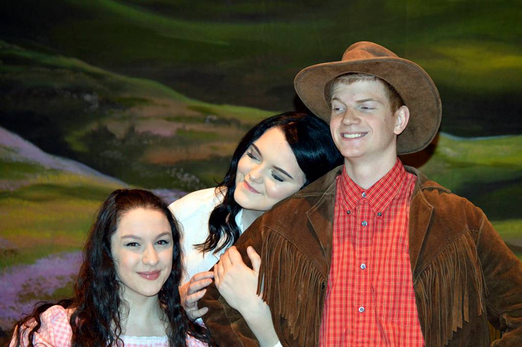 Alice and Dorcas (Zoe Templeton and Marissa Wagner) try to win the affection of Adam Pontipee (Ben Fagerstedt).