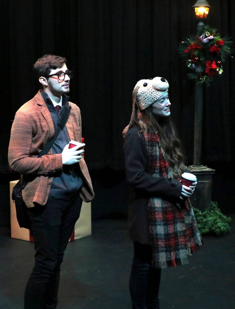 (Keith Krueger) John (Casey Bronson) and Charmian (Rebecca Meacham) browse the citys holiday display windows.