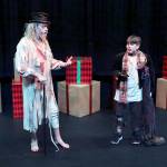 (Keith Krueger) Zombie Scrooge (played by Al Carter) and Tiny Tim (Michael Turpin), part of a holiday window display, argue in Looking at Christmas, the Driftwood Players latest production.