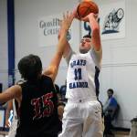 Grays Harbors Dallin Spencer hits a post fade-away over Caleb Sheldon in a game against Skagit on Friday. Spencer led the team with 10 rebounds. (Hasani Grayson | Grays Harbor News Group)