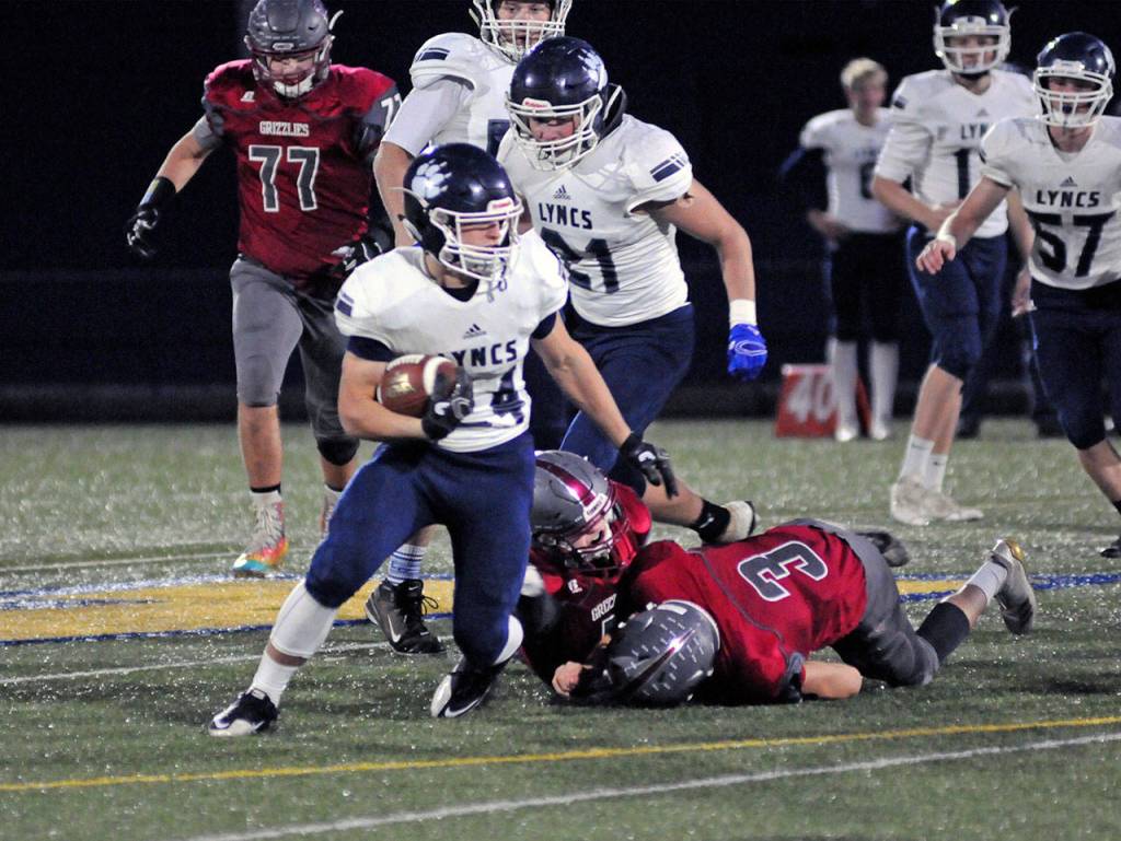 Lynden Christian running back Levi Corthuis runs for a first down during the first half of a 1A State Football Quarterfinal playoff game against Hoquiam on Saturday at Stewart Field. (Ryan Sparks | Grays Harbor News Group)