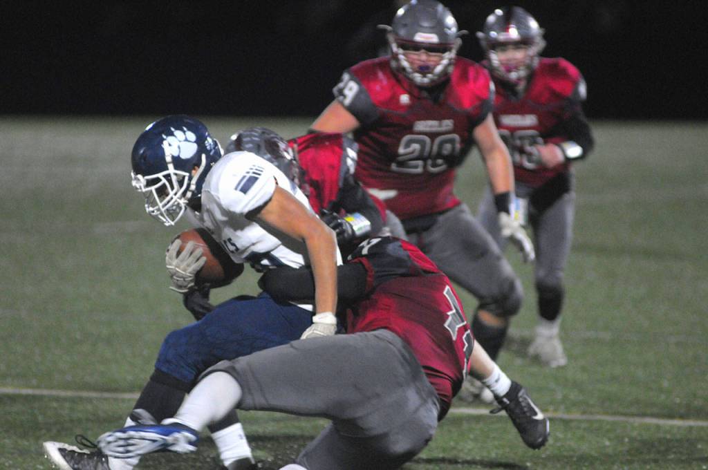 Hoquiams Larry Leonard tackles Lynden Christians Sam Faber the 1A State Football Quarterfinal game on Saturday. (Hasani Grayson | Grays Harbor News Group)