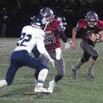 Cameron Bumstead follows his blockers downfield after catching a screen pass from Jackson Folkers in the third quarter of the1A State Football Quarterfinal game against Lynden Christian on Saturday. (Hasani Grayson | Grays Harbor News Group)