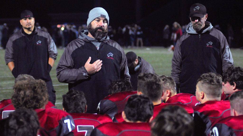 Hoquiam head coach Jeremey McMillan addresses his team after a loss to Lynden Christian on Saturday. (Hasani Grayson | Grays Harbor News Group)