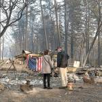 President Donald Trump surveys the damage with Paradise Mayor Jody Jones as they tour the Skyway Villa Mobile Home and RV Park during his visit of the Camp Fire in Paradise, Calif. on Saturday, 2018. The Camp Fire in Northern California has become the nations deadliest wildfire in a century and has killed at least 63 people and left about 1,000 still missing. (Paul Kitagaki Jr./The Sacramento Bee)