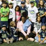 Seattle Seahawks linebacker Shaquem Griffin meets with a group of kids from NubAbility, a non-profit for kids with limb loss to get into mainstream sports after a game against the Oakland Raiders at CenturyLink Field in Seattle on August 30, 2018. (Bettina Hansen/Seattle Times)
