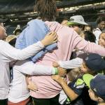 Seattle Seahawks linebacker Shaquem Griffin meets with a group of kids from NubAbility, a non-profit for kids with limb loss to get into mainstream sports after a game against the Oakland Raiders at CenturyLink Field in Seattle on August 30, 2018. (Bettina Hansen/Seattle Times)