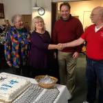 Louis Krauss | Grays Harbor News Group                                Lonnie Wild (left), CCAP Senior Nutrition Coordinator Vicky Johnson, Jason Hoseney from CCAP and Mike Simonds from the Aberdeen Eagles Club pose next to a cake welcoming CCAP after they purchased the old Eagles building.