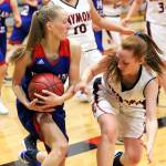 Willapa Valleys Hannah Cook, left, protects the ball from Raymonds Izzy Silvernail during the Trojans win on Thursday. (Photo by Larry Bale)