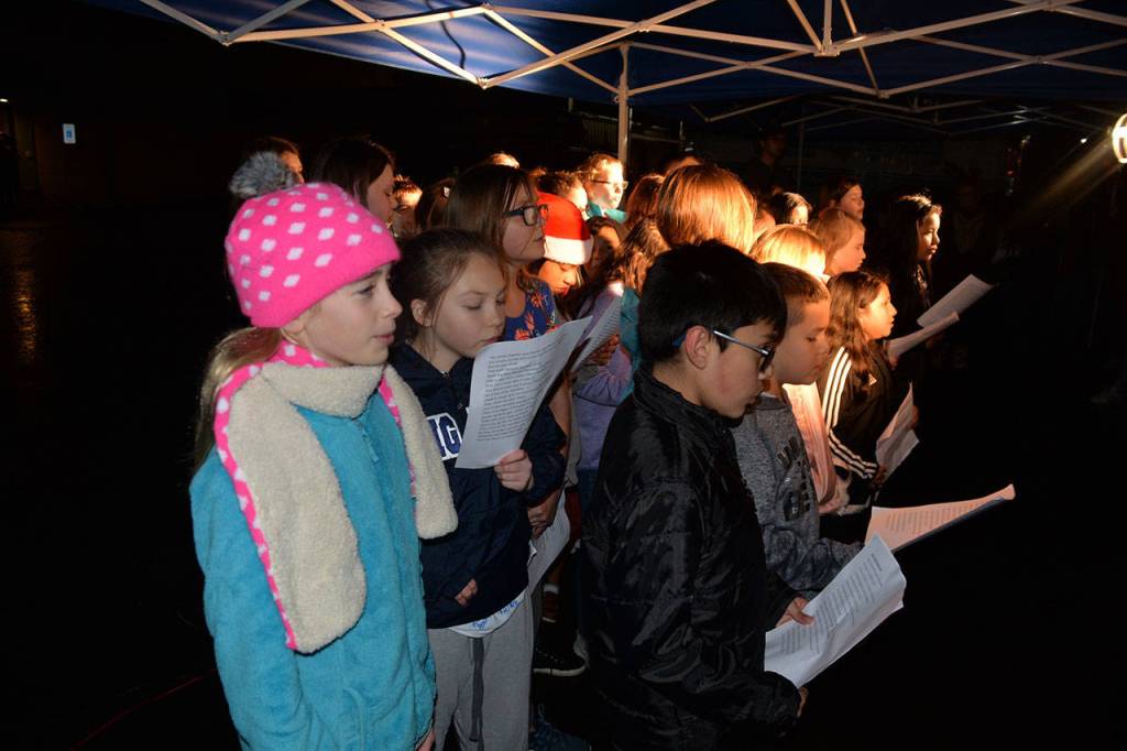 (Louis Krauss | Grays Harbor News Group)                                Robert Gray Elementary students sing Christmas tunes at Fridays Winterfest event in Aberdeen.