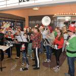 DAN HAMMOCK | GRAYS HARBOR NEWS GROUP                                Hoquiams holiday ensemble, with members of the high and middle school bands, performs a selection of holiday favorites under the marquee at the 7th Street Theatre as part of the annual Hoquiam Business Association Ho Ho Hoquiam celebration Saturday.