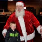 (Louis Krauss | Grays Harbor News Group)                                Ryan Housden poses with Santa at Zelasko Park in Aberdeen on Friday.