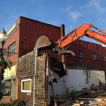 Louis Krauss | Grays Harbor News Group                                An excavator from Rognlins Inc. takes down the Pourhouse building in Aberdeen.