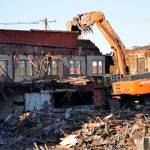 (Louis Krauss | Grays Harbor News Group)                                An excavator prepares to break off part of the old Selmers building in Aberdeen on Tuesday.