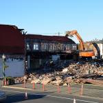(Louis Krauss | Grays Harbor News Group)                                An excavator from Rognlins Inc. demolishes the old Selmers Furniture building in Aberdeen next to the Pourhouse, which was also taken down.