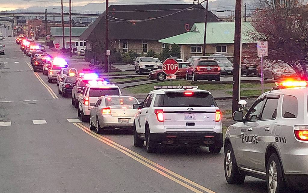 Law enforcement vehicles from across Grays Harbor County filled with kids head to Walmart from breakfast at Aberdeen High School Saturday morning for the 2018 Shop with a Cop event.