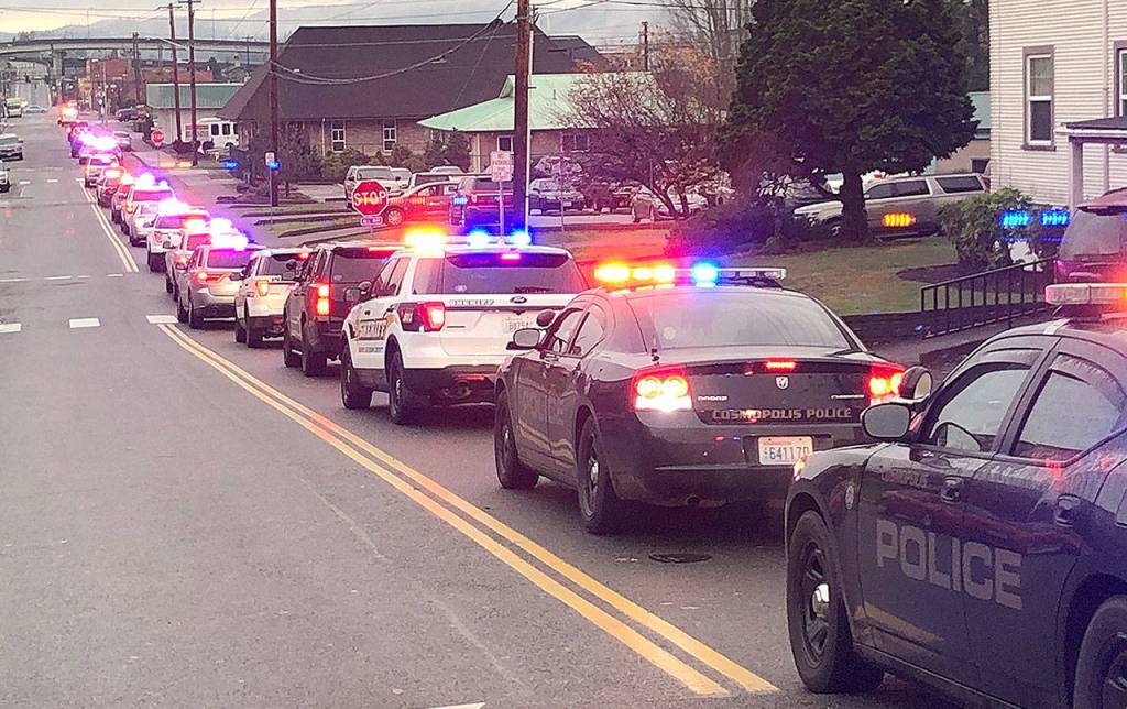 Law enforcement vehicles from across Grays Harbor County filled with kids head to Walmart from breakfast at Aberdeen High School Saturday morning for the 2018 Shop with a Cop event.