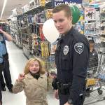 Hoquiam Police officer Christian Slater led this youngster through Walmart Saturday morning during the Grays Harbor County Shop with a Cop event. Each kid got a $100 gift certificate to spend on whatever they wanted.