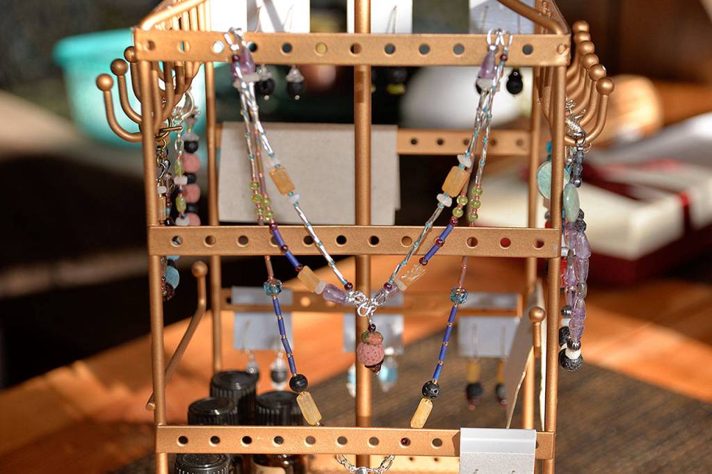 (Louis Krauss | Grays Harbor News Group) Utopian Wares also has a collection of jewelry that Nathan and Julie Kennedy make with beads and spherical lava rocks.