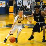 Aberdeens Ben Dublanko, right, drives toward the paint in the fourth quarter against RA Long on Tuesday. Dublanko had 9 points and four assists in the game. (Hasani Grayson | Grays Harbor News Group)