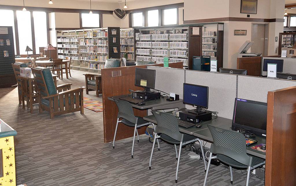 DAN HAMMOCK | GRAYS HARBOR NEWS GROUP                                 The computer section at the Hoquiam Timberland Library. Electricians were expected Friday afternoon to install a line of electrical outlets from the computer stations left toward the north wall.
