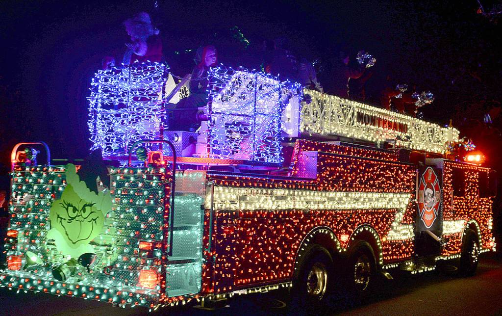 DAN HAMMOCK | GRAYS HARBOR NEWS GROUP A Montesano Fire Department truck rolls through the Festival of Lights parade Saturday evening.
