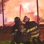PHOTO COURTESY OF GRAYS HARBOR FIRE DISTRICT 5                                Grays Harbor Fire District 5 firefighters battle a house fire on Blockhouse Road North in Elma Sunday evening.