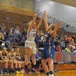 Hoquiams Jade Cox gets her shot over Rochesters Paige Winter in the second quarter of a game on Thursday at Hoquiam Square Garden. (Hasani Grayson | Grays Harbor News Group)
