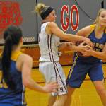 Hoquiams Maya Jump, middle, tries to rip the ball away from Rochesters Megan Elkins in the fourth quarter of a game on Thursday. (Hasani Grayson | Grays Harbor News Group)